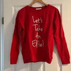 Vibrant Red Sweatshirt with Playful Slogan